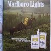 Marlboro-lights-cowboy-leading-horse-rain-yellow-slicker-ad-web
